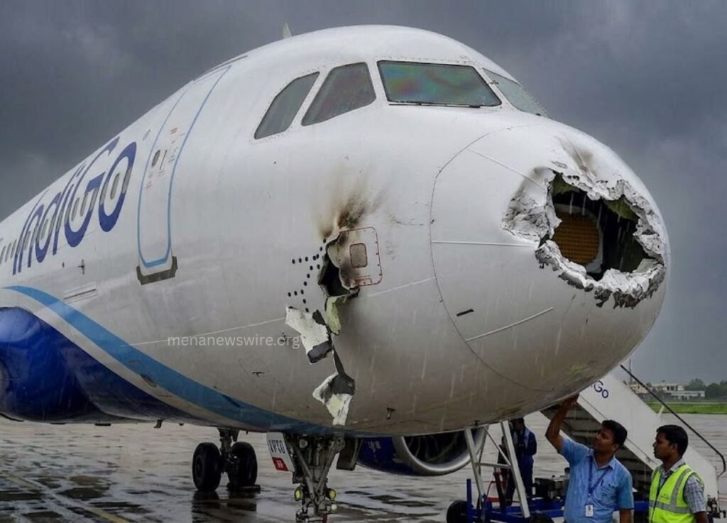 menanewswireorg 1 - MENA News Wire Commercial airplane with a severely damaged nose cone, gate area under maintenance as staff inspect the front area.